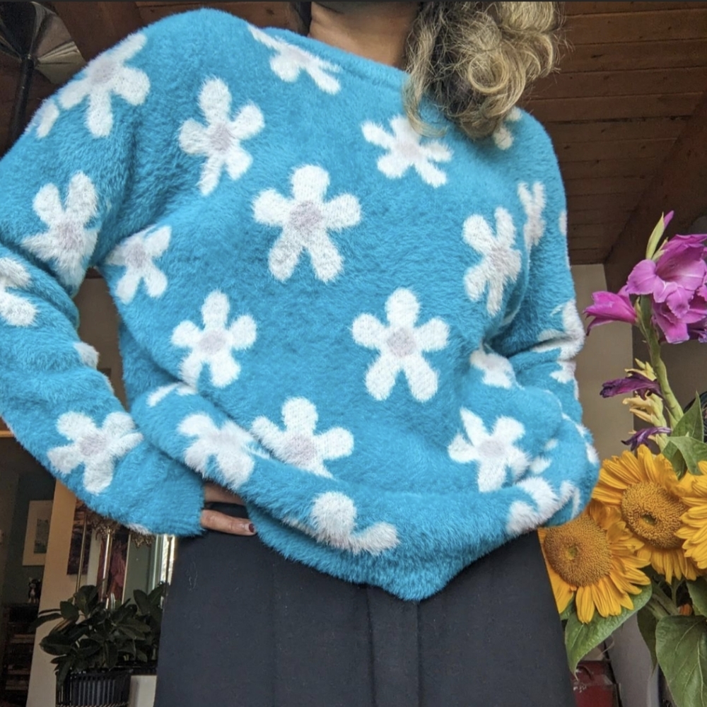 Fluffy Simon's sky blue sweater